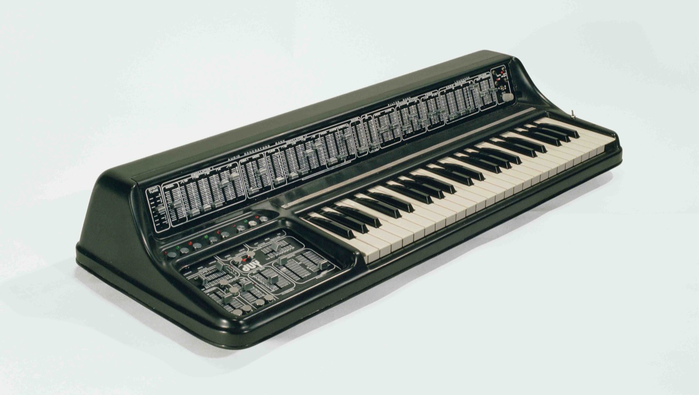 A DUY Alpha 1024 synthesiser built by hand in Barcelona in the late 1970s: two banks of sliders above a keyboard, the panel lettered AUDIO GENERATORS BANK, and the duy logo below it.